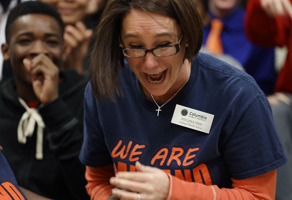 Melissa Fike reacts in surprise after receiving a Milken Educator Award